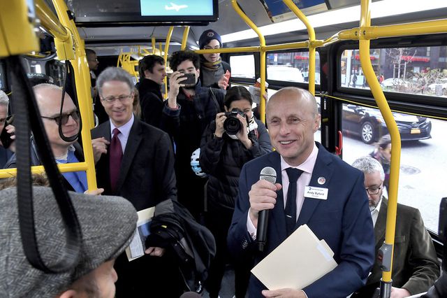 NYC Transit President Andy Byford smiles while on an M14 bus with reporters and other members of the MTA and NYC DOT